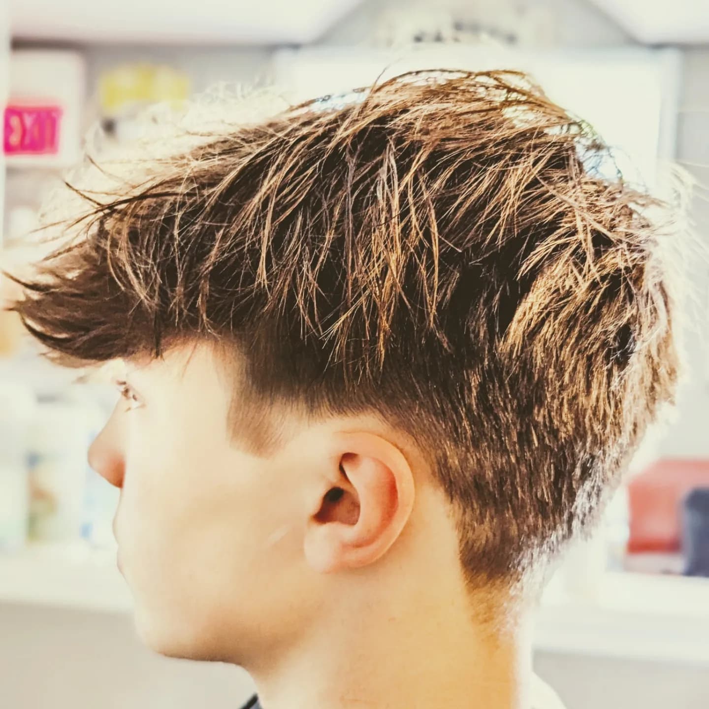 Close-up textured fringe haircut at Gary's Barber Shop